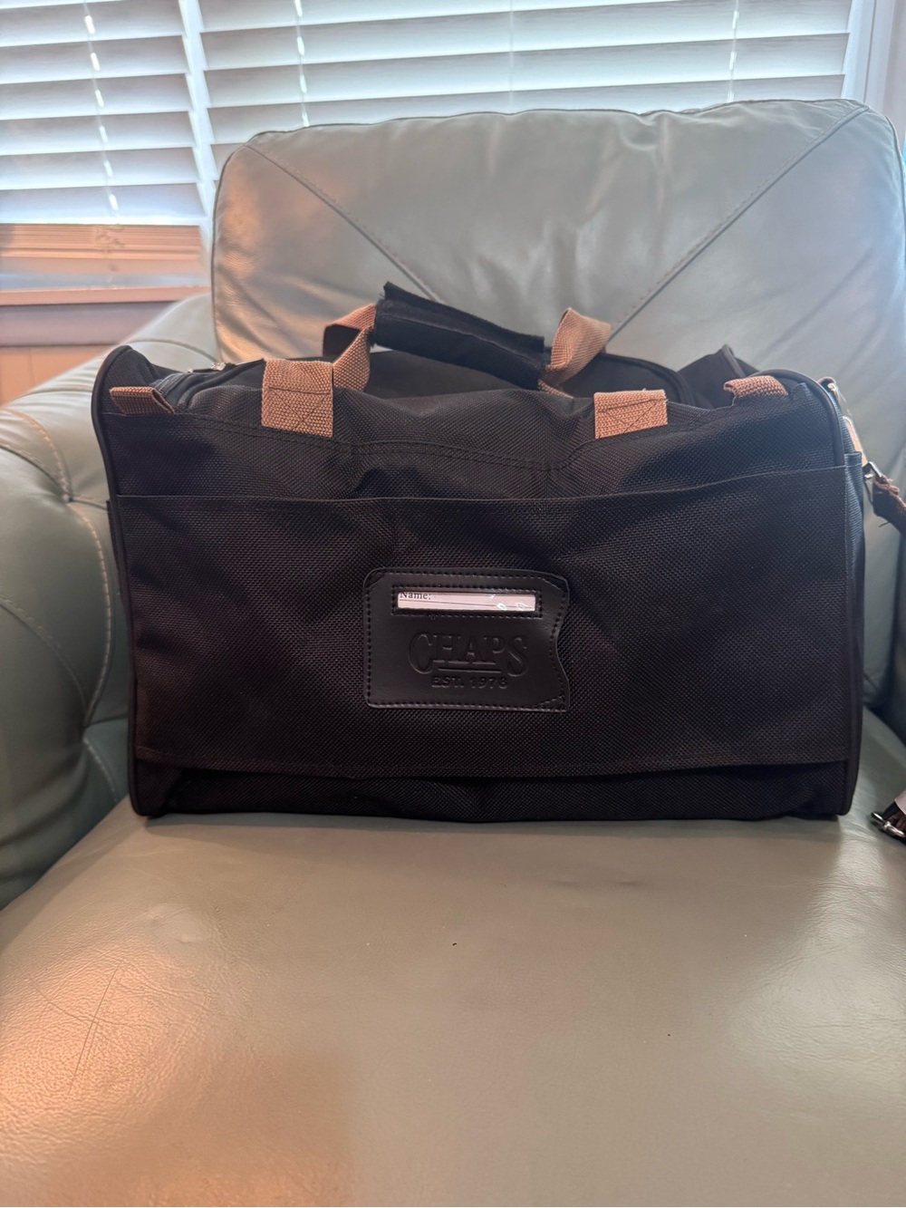 Chaps Black Duffel Bag with Tan Trim shoulder strap and double handle